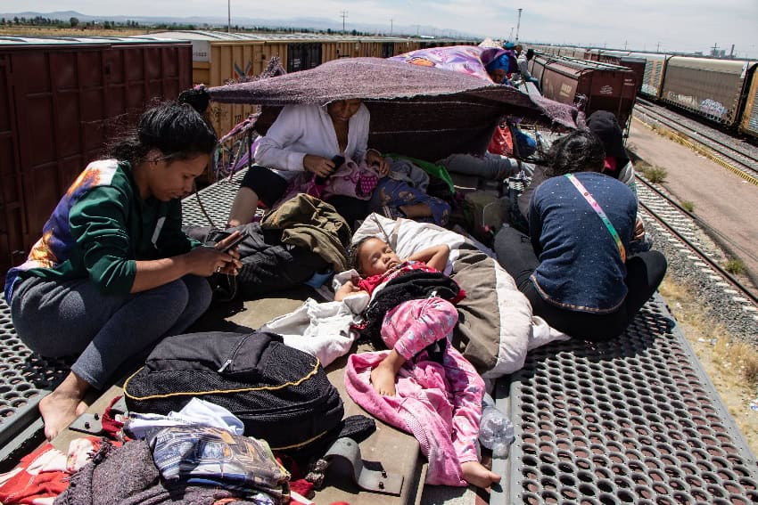 Migrants on top of a freight train