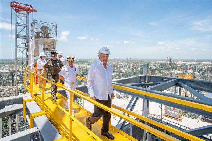President López Obrador tours the refinery as part of Friday's inaugural events.