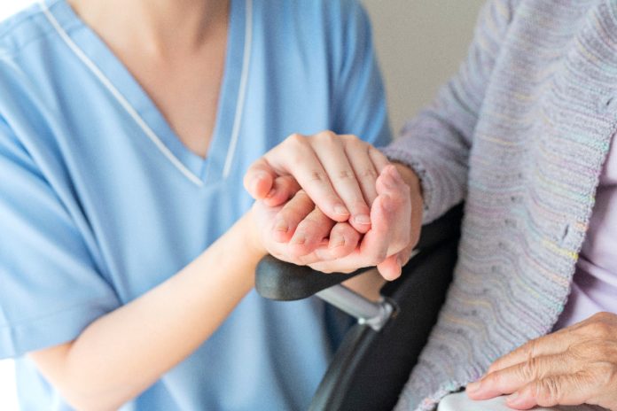 Young nurse with an elderly patient
