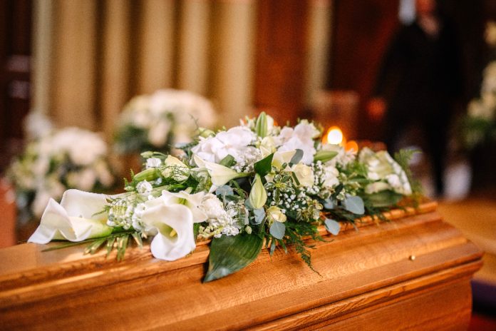 A coffin with flowers